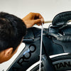 Man measuring Quintana Roo triathlon bike with a tape measure