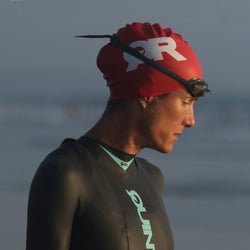 Woman wearing red swim cap