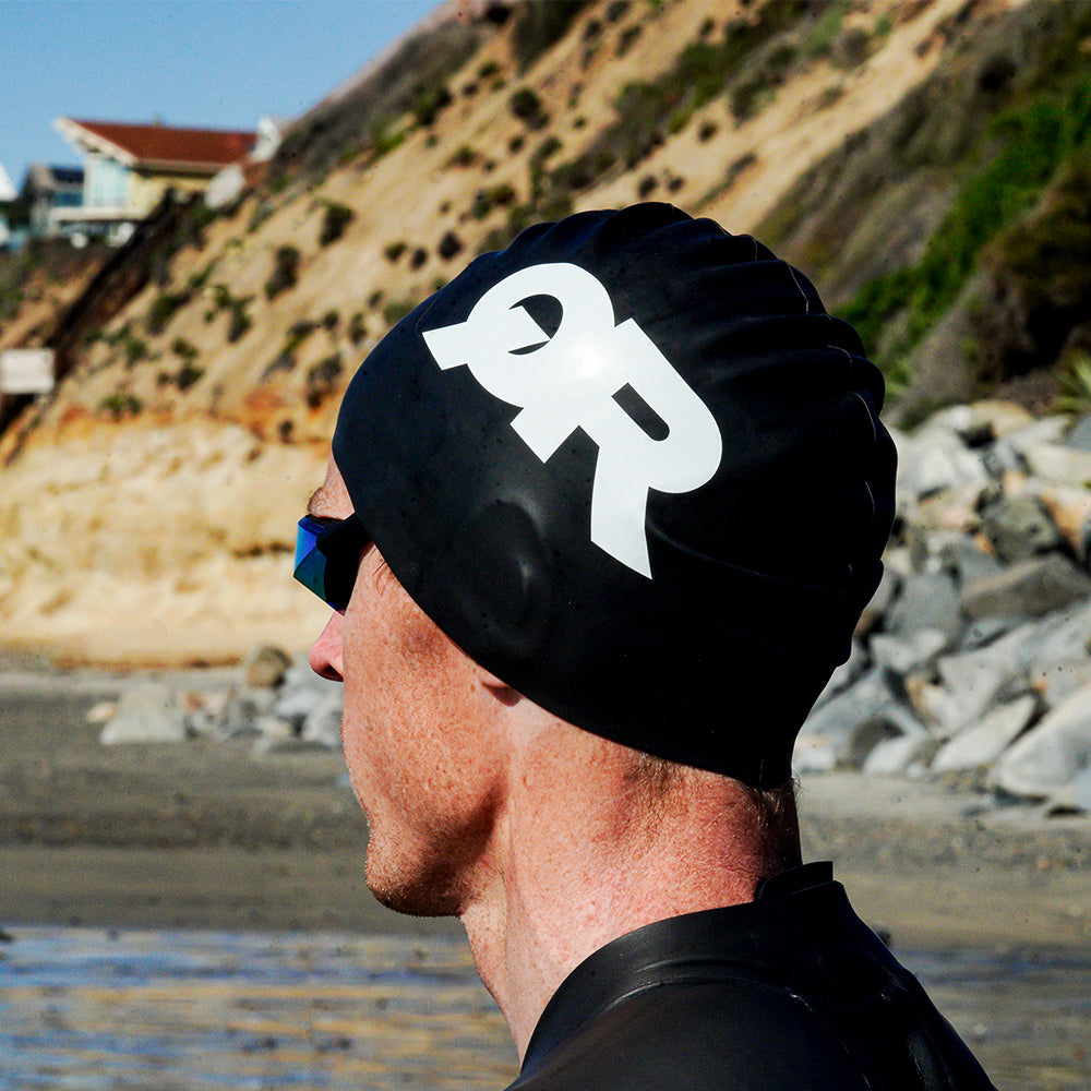 Man wearing black QR swimcap